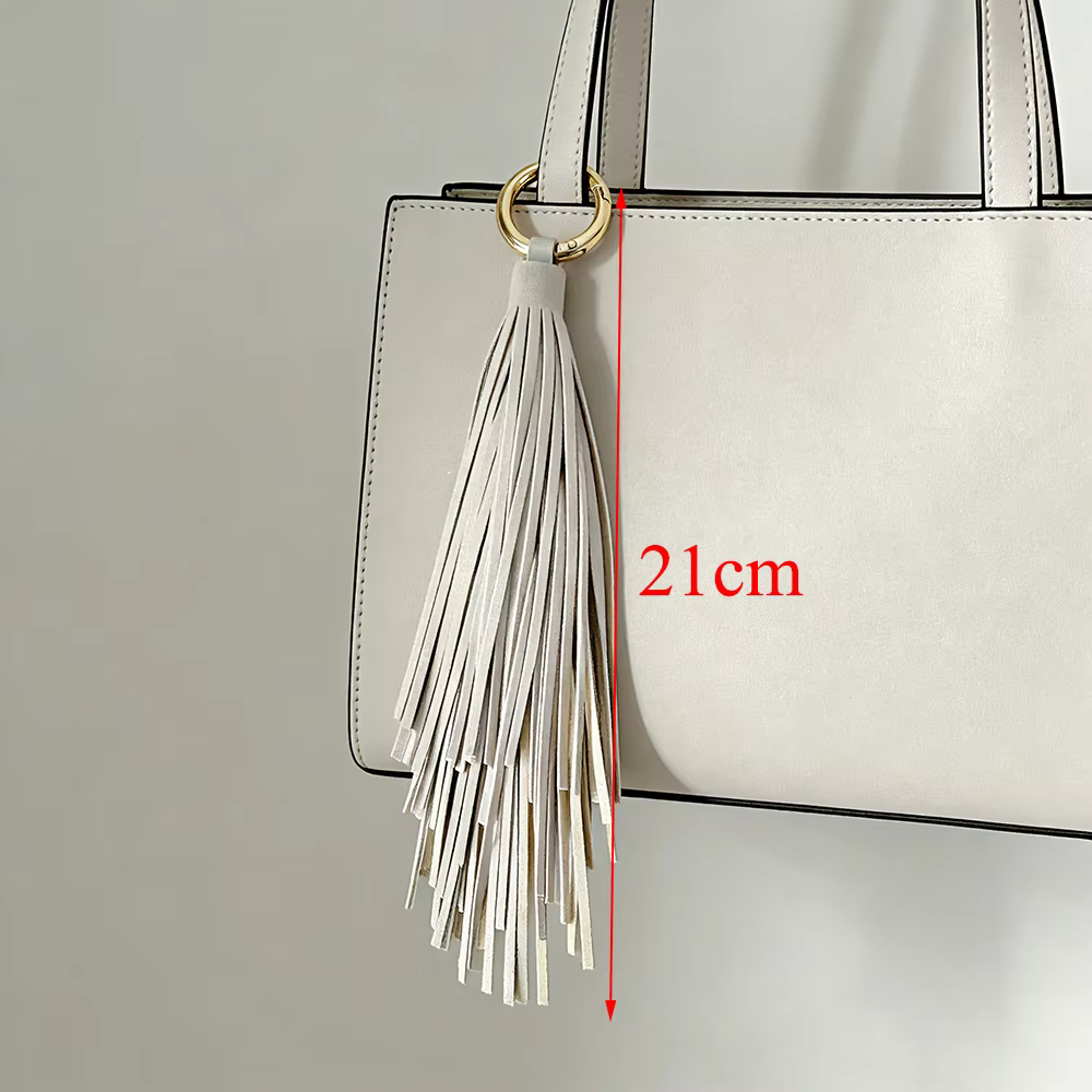 Porte-clés de luxe en cuir souple avec pompon, élégant pendentif de sac, accessoire de clé de voiture, bijou pour femme et fille, cadeau ﻿
