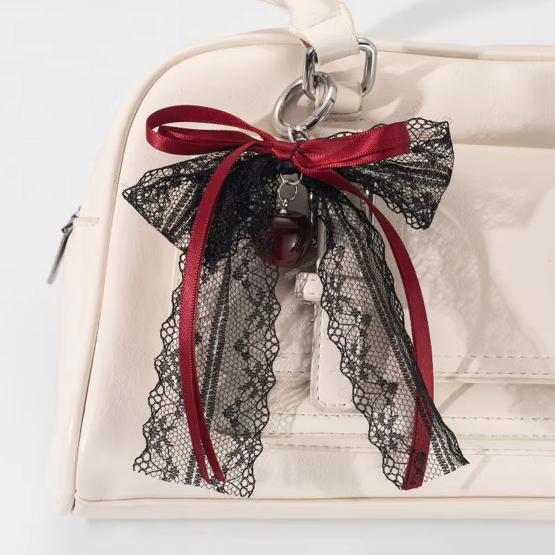 Porte-clés cadeau mignon pour la Saint-Valentin, nœud en dentelle avec chaîne de perles et breloque étoile. Accessoire de sac en ruban de ballet pour femme
